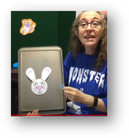 Miss Mollie from the Pollard Memorial Library uses a cookie sheet to tell stories virtually